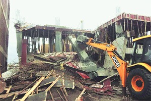 Image result for bulldozer pulls down illegal constructions