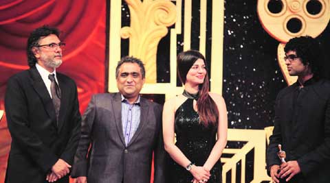 Rakeysh Omprakash Mehra and Siddharth Mahadevan take the  Best Background Score  award on behalf of Shankar-Ehsaan-Loy from Kunal Ganjawala and Kainaat Arora