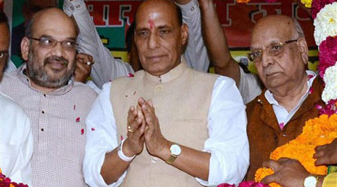  BJP President Rajnath Singh, party's UP incharge Amit Shah (left) and Lalji Tandon being garlanded at a programme in Lucknow on Thursday. (PTI Photo)