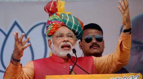 BJP's PM candidate Narendra Modi addresses an election campaign rally in Anand on Monday. (PTI Photo)