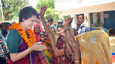  Priyanka Vadra is greeted by women during her election campaign for her mother and Congress President Sonia Gandhi in Raebareli on Wednesday. (PTI)