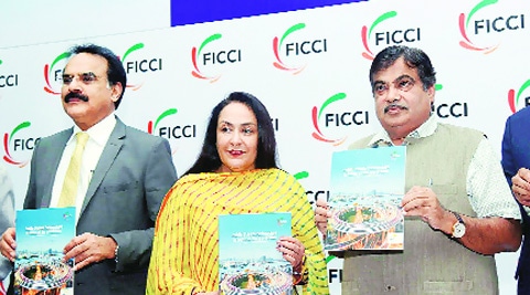 Union Minister for Transport and Shipping Nitin Gadkari with Finance Secretary Arvind Mayaram and Jyotsna Suri, Senior Vice-President, Ficci at the India PPP Summit 2014. PTI