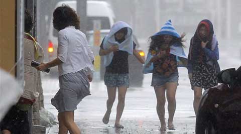 okinawa japan typhoon neoguri islands winds naha strong southern walk july tuesday evacuate approaches told million half lashes halt traffic