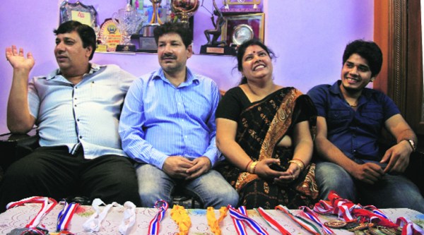 (From left) Abhishek Verma’s uncle, father and mother at their residence in north Delhi on Saturday. Source: Gajendra Yadav