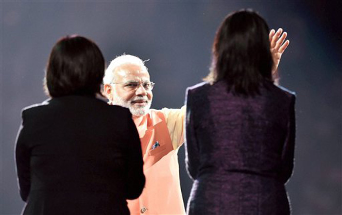 Prime Minister Narendra Modi waves at crowd during a reception organised in his honour by the Indian American Community Foundation at Madison Square Garden in New York on Sunday. (Source: PTI)