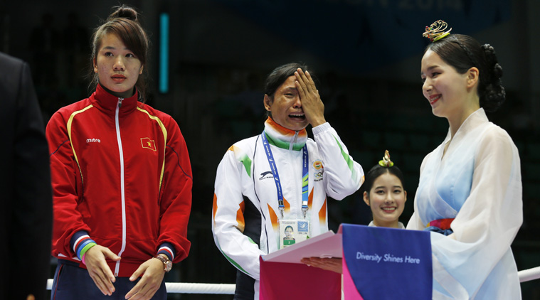 India's La Sarita Devi cries as she waits for tyhe medal at the podium on Wednesday. (Source: AP)