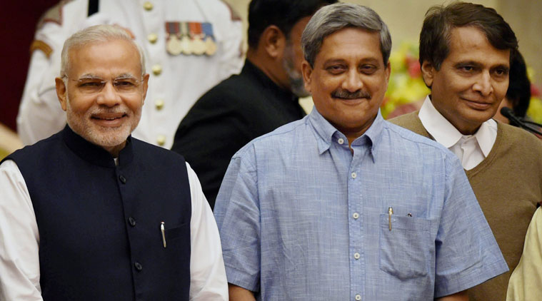 Prime Minister Narendra Modi with newly sworn-in Cabinet ministers Manohar Parrikar and Suresh Prabhu at the oath taking ceremony for new ministers at Rashtrapati Bhavan in New Delhi on Sunday.  (Source: PTI)