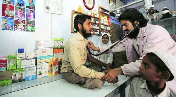 A file photo of Dr Salman Farsi with a patient. On Wednesday, he had to attend to two villagers who mishandled gelatin sticks.