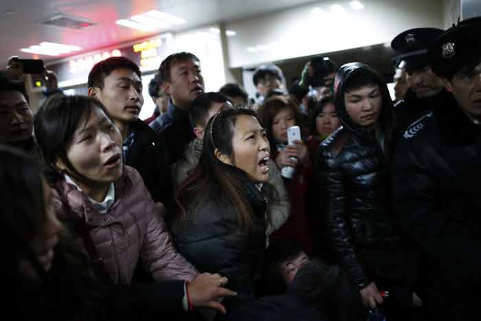 Shanghai: Fake money causes stampede on New Years Eve, 36 dead.