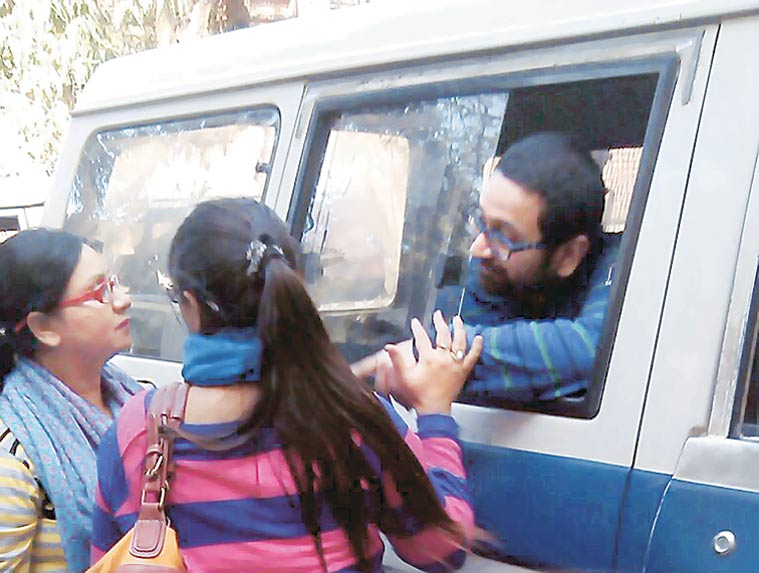 Tinku Singh being taken away by the police.