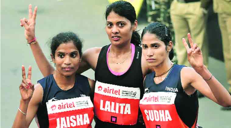 Lalita Babbar flanked by second-place finisher OP Jaisha and Sudha Singh who finished third among the Indian category for women at the Delhi half-marathon.