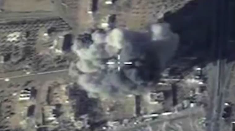 In this photo made from the footage taken from Russian Defense Ministry official web site and provided Wednesday, Dec. 9, 2015 an aerial image shows cruise missile strike on a local ISIS headquarters in Syria. (Russian Defense Ministry Press Service via AP)