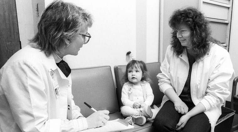 In this June 1988 photo, Nicole Frye looks up at Lynn Bartos. (Source: AP)