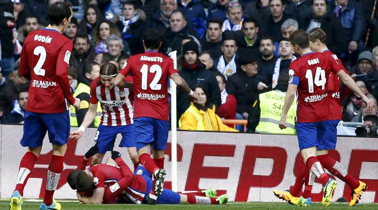 Atletico Madrid's players celebrate their first goal during the match