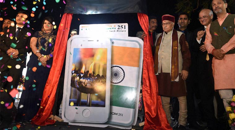BJP Senior leader Murli Manhore Joshi ,Director of Ringing Bells, Mohit Goel and CEO, Dhaarna Goel during the launch of Smartphone-Ringing Bells Freedom 251, in New Delhi on Wednesday. (Source: PTI)