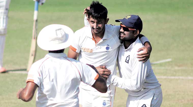 Puneet Datey is mobbed after picking up a Bengal wicket. He and Ishwar Pandey rocked the Bengal innings, giving MP a huge first innings lead. (Express Photo by: Kevin d’Souza)