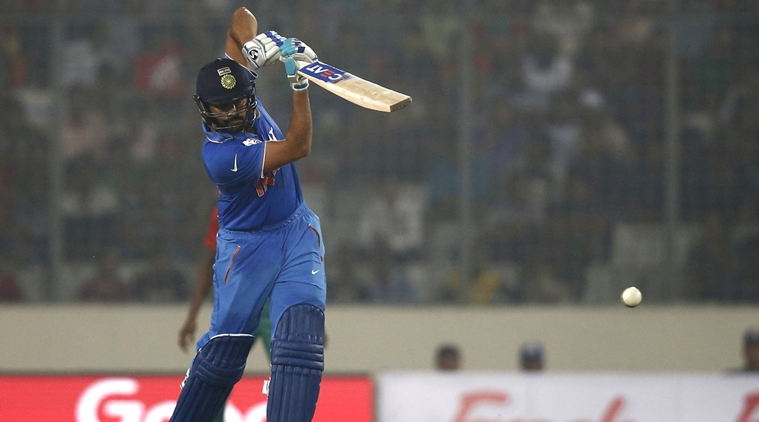 India's Rohit Sharma plays a shot against Bangladesh during the Asia Cup Twenty20 international cricket match in Dhaka, Bangladesh, Wednesday, Feb. 24, 2016. (AP Photo/A.M. Ahad)
