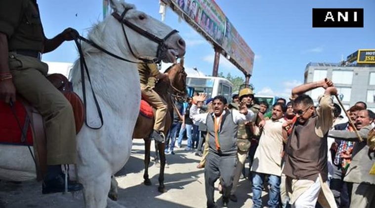 BJP MLA lathicharging a police horse in Dehradun on Monday. ANI photo