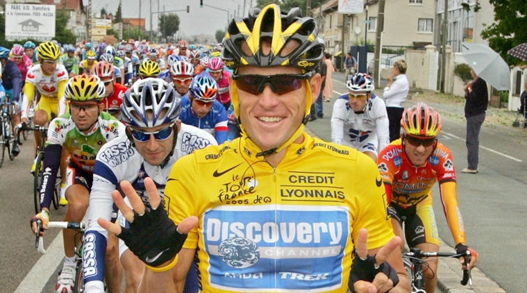 FILE - In this July 24, 2005, file photo, overall leader Lance Armstrong signals seven for his seventh straight win in the Tour de France cycling race as he pedals during the 21st and final stage of the race between Corbeil-Essonnes, south of Paris, and the French capital. Armstrong confessed to using performance-enhancing drugs to win the Tour de France during a taped interview with Oprah Winfrey that aired Thursday, Jan. 17, 2013, reversing more than a decade of denial. Armstrong called his run to seven Tour de France titles "so perfect for so long." (AP Photo/Peter Dejong, File)