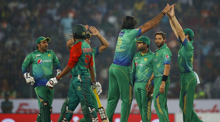 Pakistan’s Mohammad Irfan, center, celebrates with his teammates after the dismissal of Bangladesh’s Tamim Iqbal, second left, during their Asia Cup Twenty20 international cricket match in Dhaka, Bangladesh, Wednesday, March 2, 2016. (AP Photo/A.M. Ahad)