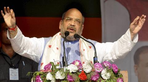 Sualkuchi: BJP president Amit Shah addressing an election rally at Sualkuchi in Kamrup district of Assam on Saturday. PTI Photo(PTI4_9_2016_000115A)