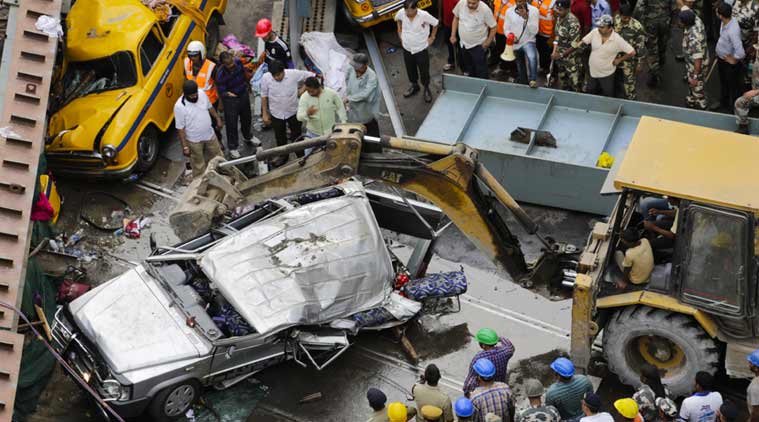 A long section of a road overpass under construction collapsed Wednesday in a crowded Kolkata neighborhood, with tons of concrete and steel slamming into midday traffic, killing over 20 and injuring many. (Source:AP) 
