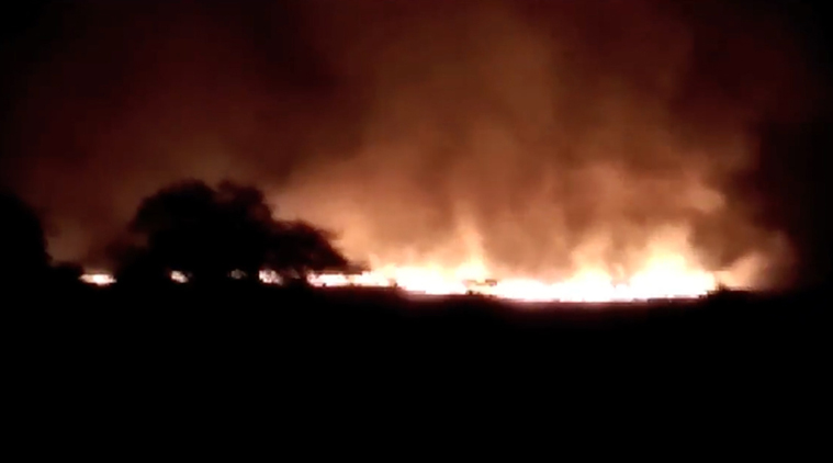 In this image made from video of K.K.Productions, a huge fire is seen at the Pulgaon ammunition depot in Pulgaon in the Indian state of Maharastra, Tuesday, May 31, 2016. (Source: PA)