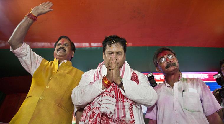 Bharatiya Janata Party, (BJP) leader Sarbanada Sonowal, center, greet his supporters after party won state assembly elections in Gauhati, India , Thursday, May 19, 2016. India's ruling Hindu nationalist party made dramatic gains in elections in the eastern state of Assam but trailed in four other states, the election commission said Thursday. Local parties dominated the results in West Bengal, Tamil Nadu and Kerala states, while the Congress won in Pondicherry. (AP Photo/ Anupam Nath)