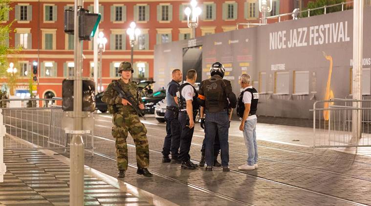 Police officers and a soldier stand by the sealed off area of after the Attack in Nice. (Source:AP)