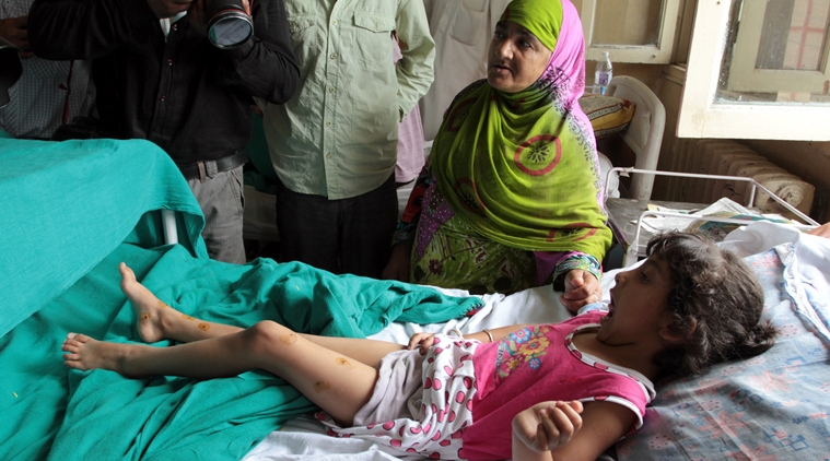Five year-old Zohra Zahoor, who has pellet wounds on her legs, forehead and abdomen, admitted a hospital in Srinagar. 