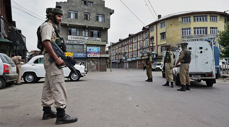  Security jawans during restriction and strike on fourth consecutive day in Srinagar on Tuesday. Authorities imposed restrictions in most parts of Valley following the killing of most wanted Hizbul Mujahideen commander, Burhan Muzaffar Wani, along with his two associates. (Source: PTI)