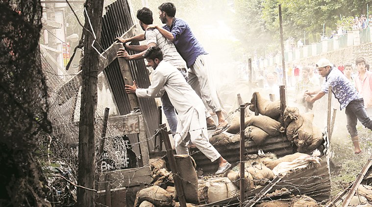 Protesters attack a security bunker in north Kashmir's Bandipora district on Monday. Shuaib Masoodi