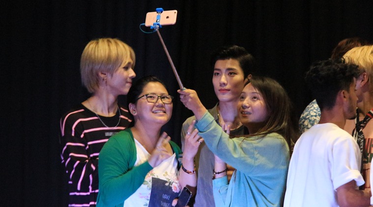 Fans take a selfie with members of IMFACT, a K-pop band, in Gangtok during the regional finals of the 2016 K-Pop India contest. (Source: Express photo by Rinchen Dorjee Lepcha)