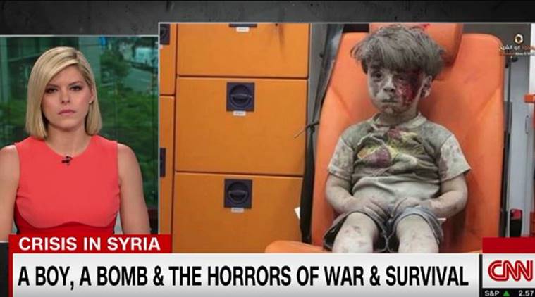 syrian boy, haunting syrian boy, aleppo boy, ambulance boy, syrian boy video, CNN, CNN anchor, CNN anchor crying, CNN video, syria news, world news