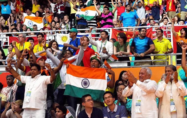 Rio de Janeiro : Supporters of India holding tricolor during a women's singles final match at the 2016 Summer Olympics in Rio de Janeiro, Brazil on Friday. PTI Photo by Atul Yadav(PTI8_19_2016_000334a)