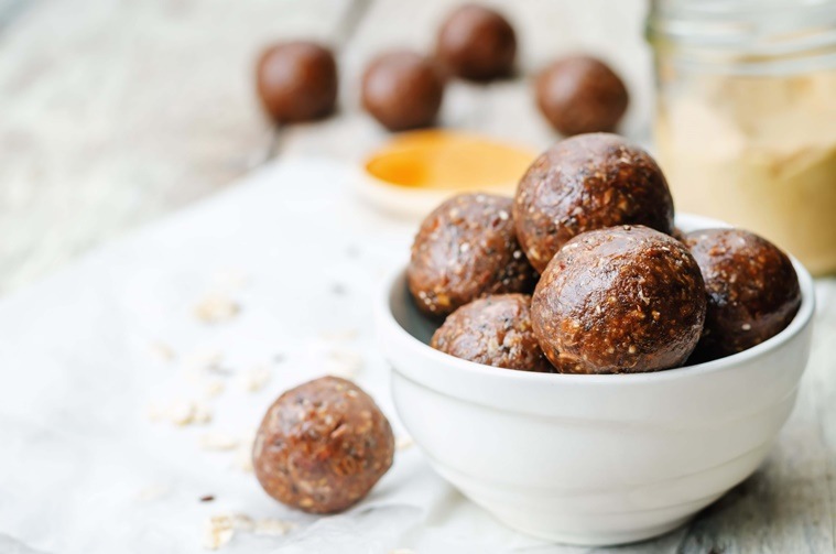 Raw vegan peanut butter oat coconut cacao balls. the toning. selective focus