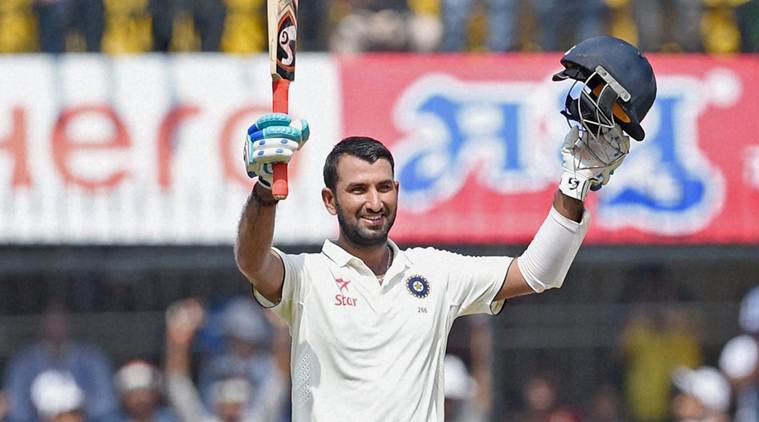 Image result for cheteshwar pujara with man of the match trophy