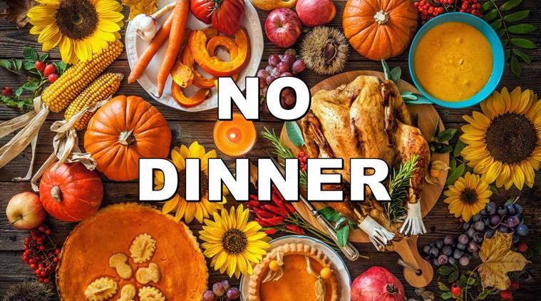 Thanksgiving dinner. Roasted turkey with pumpkins and sunflowers on wooden table