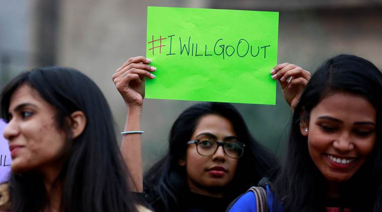 Women wait for the start of the #IWillGoOut rally, organized to show solidarity with the Women's March in Washington, along a street in New Delhi, India January 21, 2017. REUTERS/Cathal McNaughton