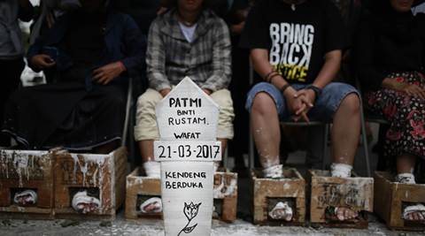 Indonesian farmers cement feet to protest factory | The Indian Express