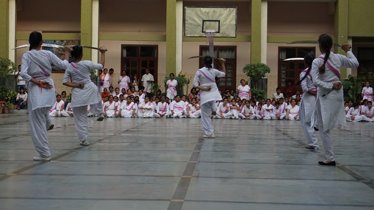 RSS Women's Wing girls exhibit their sword-wielding skills.