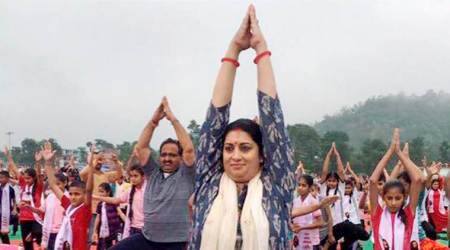 Yoga guru Ravi Shankar and minister Irani lead Yoga enthusiasts in Himachal