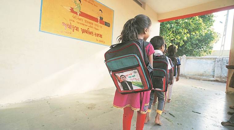 Chhota Udepur Enrollment Drive, School Bags Akhilesh photo, Akhilesh School Bags, Gujarat chool Bags Akhilesh photo, Education News, Indian Express, Indian Express News