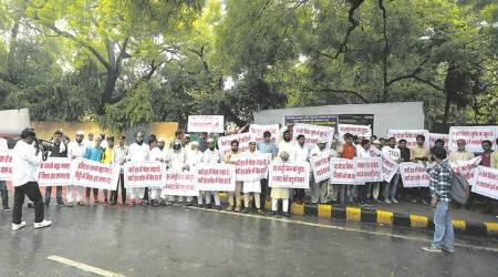 Amid protests against lynching, a father sits in silence