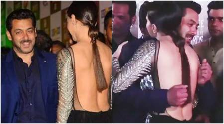 Salman Khan hugs Bigg Boss fame Sana Khan but his shy smile and closed fists speak a different story. See photo