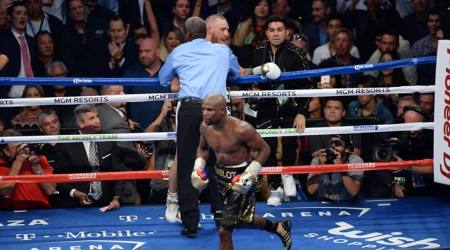 Floyd Mayweather beats Conor McGregor in TKO win; announces retirement
