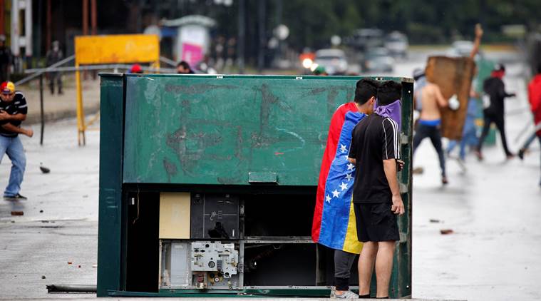 venezuela, venezuela political crisis, caracas violence, venezuela military, valencia military base attack, indian express