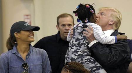 Donald Trump pitches in at shelter for Harvey victims