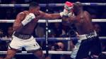 Anthony Joshua stops Carlos Takam, just about