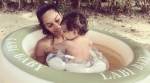 Lisa Haydon finds a new swimming partner in her baby Zack. See photo